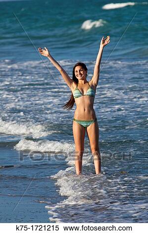 Teen girl happy to be at beach View Large Photo Image Stock Photography - Teen girl happy to be at beach. Fotosearch