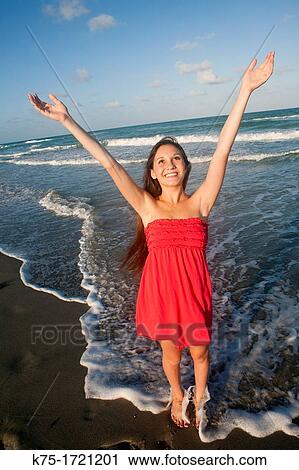 Teen girl happy to be at the beach View Large Photo Image Stock Image - Teen girl happy to be at the beach. Fotosearch