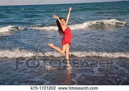 Teen girl happy to be at the beach View Large Photo Image Stock Image - Teen girl happy to be at the beach. Fotosearch