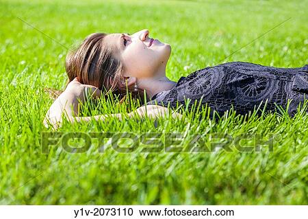 Stock Image - Teen girl in a park.. Fotosearch