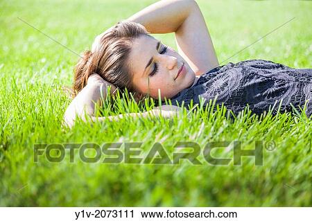 Teen girl in a park. View Large Photo Image Stock Image - Teen girl in a park.. Fotosearch
