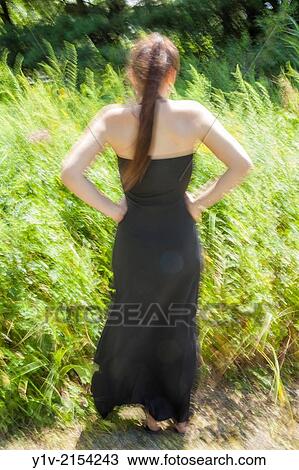 Stock Image - Teen girl in a park.. Fotosearch