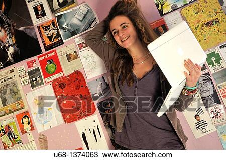 Teen girl in her bedroom with laptop computer View Large Photo Image Stock Image - Teen girl in her bedroom with laptop computer. Fotosearch