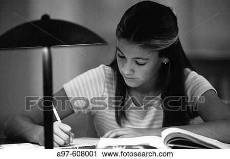 Teen girl in library doing homework View Large Photo Image Stock Image - Teen girl in library doing homework. Fotosearch