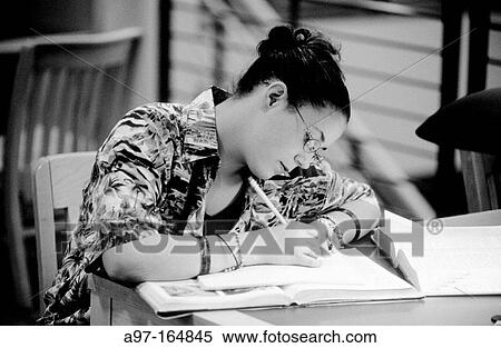 Stock Photography - Teen girl in library. Fotosearch