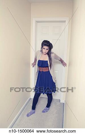 Teen girl in the hallway of her house View Large Photo Image Picture - Teen girl in the hallway of her house. Fotosearch