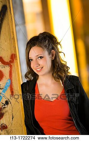Teen girl is waiting in a corridor View Large Photo Image Picture - Teen girl is waiting in a corridor. Fotosearch