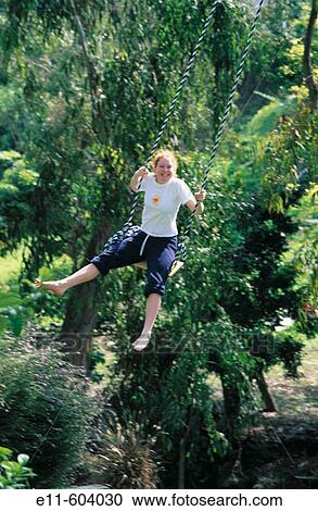 Teen girl on swing View Large Photo Image Stock Image - Teen girl on swing. Fotosearch
