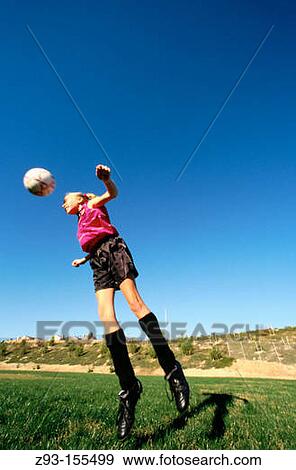 Stock Photo - Teen girl playing soccer. Fotosearch