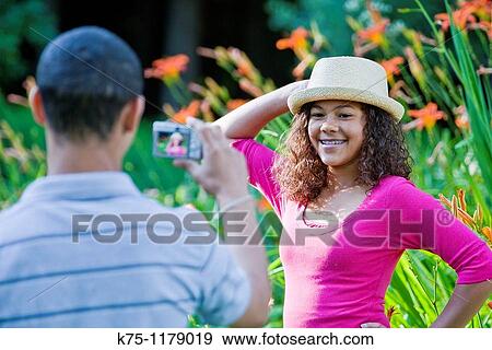 Teen girl posing for photo View Large Photo Image Stock Photo - Teen girl posing for photo. Fotosearch