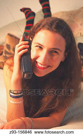 Teen girl talking on phone View Large Photo Image Stock Photograph - Teen girl talking on phone. Fotosearch