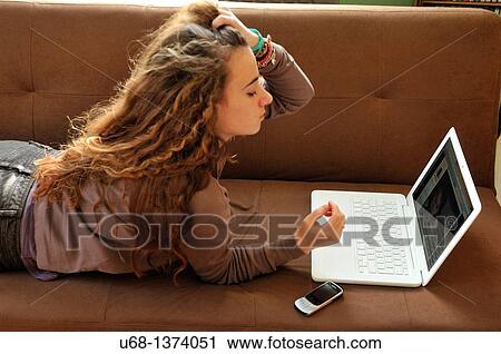 Teen girl using laptop computer View Large Photo Image Stock Image - Teen girl using laptop computer. Fotosearch