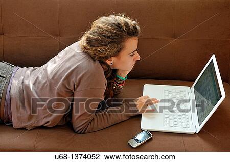 Teen girl using laptop computer View Large Photo Image Stock Image - Teen girl using laptop computer. Fotosearch
