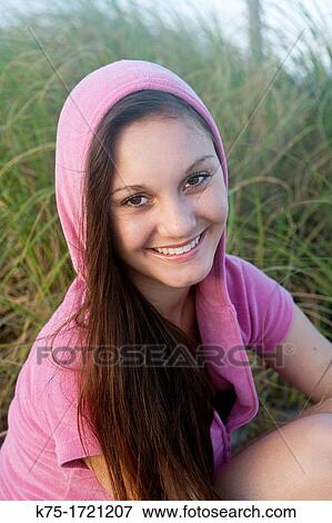 Stock Photo - Teen girl wearing hoodie portrait. Fotosearch