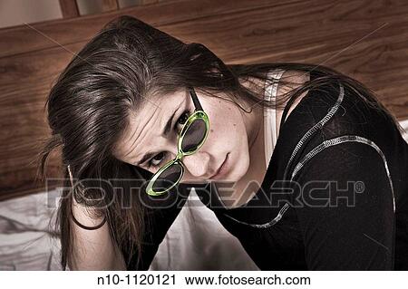 Teen girl wearing sunglasses View Large Photo Image Stock Image - Teen girl wearing sunglasses. Fotosearch