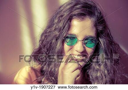 Teen girl wearing sunglasses View Large Photo Image Stock Photo - Teen girl wearing sunglasses. Fotosearch
