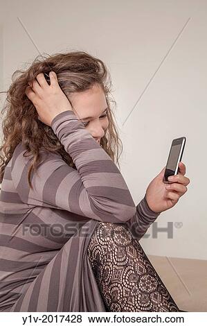 Teen girl with her smart phone. View Large Photo Image Stock Photo - Teen girl with her smart phone.. Fotosearch