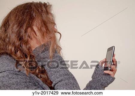 Teen girl with her smart phone. View Large Photo Image Stock Photo - Teen girl with her smart phone.. Fotosearch