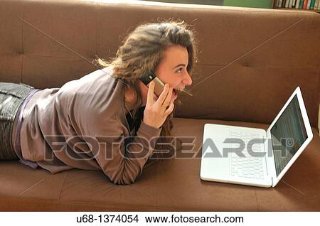 Teen girl with laptop computer and cell phone View Large Photo Image Picture - Teen girl with laptop computer and cell phone. Fotosearch