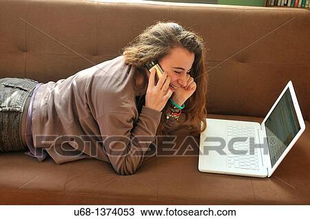 Teen girl with laptop computer and cell phone View Large Photo Image Stock Image - Teen girl with laptop computer and cell phone. Fotosearch