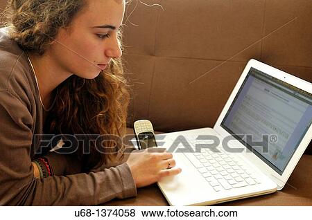 Teen girl with laptop computer and cell phone View Large Photo Image Stock Photo - Teen girl with laptop computer and cell phone. Fotosearch