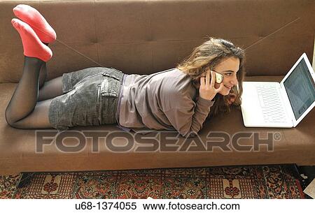 Teen girl with laptop computer and cell phone View Large Photo Image Stock Photography - Teen girl with laptop computer and cell phone. Fotosearch