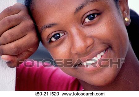 Stock Image - Teen girl with smile. Cura? ao. Caribbean. Fotosearch