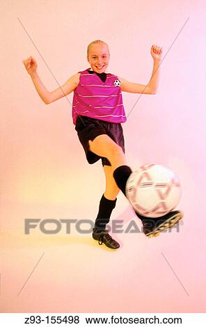 Teen girl with soccer ball View Large Photo Image Stock Photo - Teen girl with soccer ball. Fotosearch