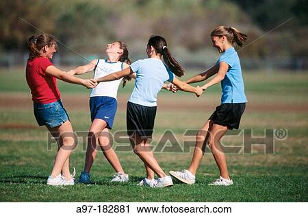 Stock Image - Teen girls in a circle. Fotosearch