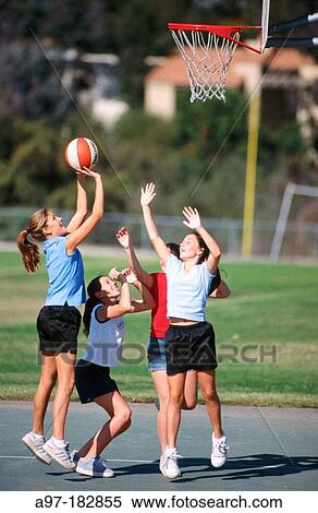 Teen girls playing basketball View Large Photo Image Stock Photography - Teen girls playing basketball. Fotosearch