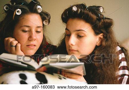 Teen girls reading in bed View Large Photo Image Stock Image - Teen girls reading in bed. Fotosearch
