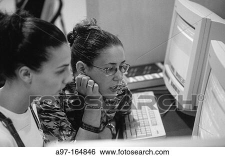 Teen girls use computer View Large Photo Image Stock Photograph - Teen girls use computer. Fotosearch