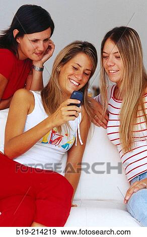 Teen girls with cellular phone View Large Photo Image Stock Photo - Teen girls with cellular phone. Fotosearch