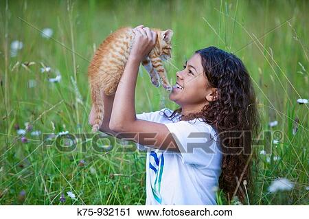 Teen holding kitten View Large Photo Image Stock Image - Teen holding kitten. Fotosearch