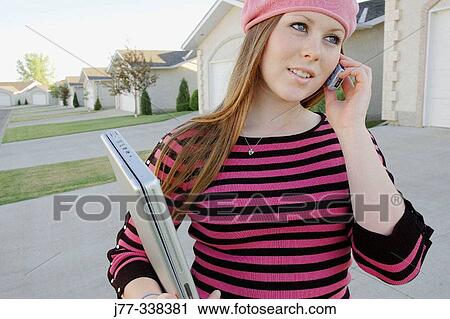 Teen in the burbs on her cell View Large Photo Image Stock Image - Teen in the burbs on her cell. Fotosearch