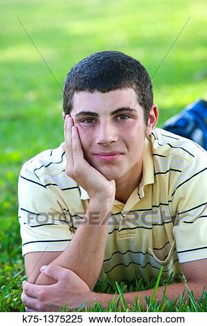 teen lying on lawn View Large Photo Image Stock Photography - teen lying on lawn. Fotosearch