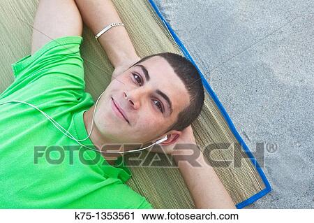 teen lying on the beach View Large Photo Image Stock Image - teen lying on the beach. Fotosearch