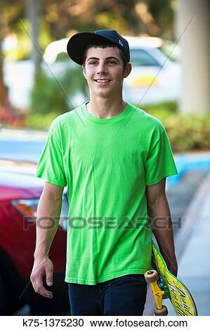 teen male with skateboard View Large Photo Image Stock Image - teen male with skateboard. Fotosearch