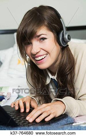 Teen schoolgirl doing homework View Large Photo Image Stock Image - Teen schoolgirl doing homework. Fotosearch