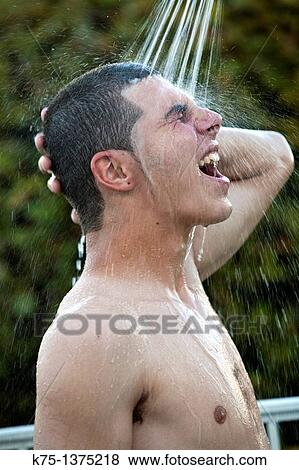 teen showering outdoors View Large Photo Image Stock Photo - teen showering outdoors. Fotosearch