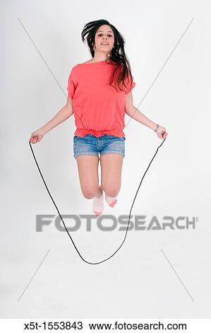 Teen Skips Rope on whte background View Large Photo Image Stock Image - Teen Skips Rope on whte background. Fotosearch