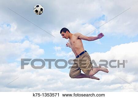 teen up in the air with soccer ball View Large Photo Image Stock Image - teen up in the air with soccer ball. Fotosearch