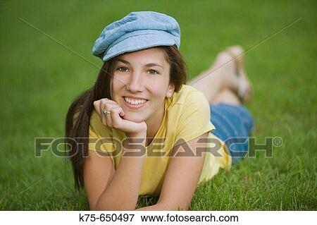 Teen wearing cap View Large Photo Image Stock Photo - Teen wearing cap. Fotosearch