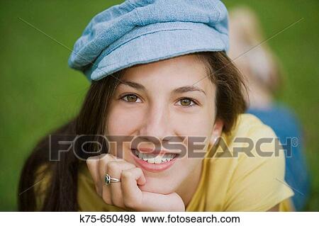 Stock Photo - Teen wearing cap. Fotosearch