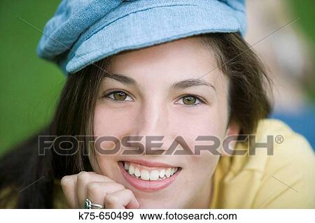 Stock Photo - Teen wearing cap. Fotosearch