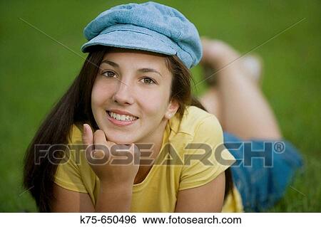 Teen wearing cap View Large Photo Image Stock Photograph - Teen wearing cap. Fotosearch