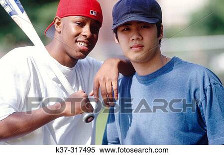 Teenage african american and asian friends View Large Photo Image Stock Photography - Teenage african american and asian friends. Fotosearch