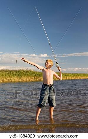 Teenage Boy Fishing by Lake V? rtsj? rv in Estonia View Large Photo Image Stock Photo - Teenage Boy Fishing by Lake V? rtsj? rv in Estonia. Fotosearch
