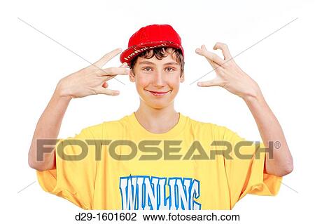 Stock Image - teenage boy in red baseball cap making gestures -isolated on white. Fotosearch