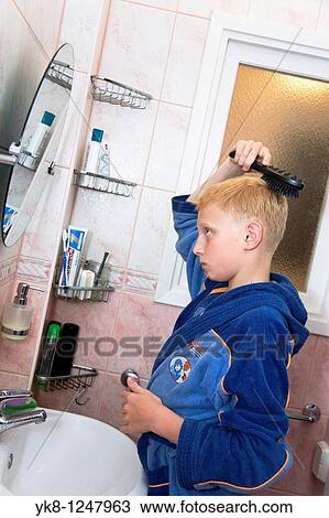 Teenage Boy Lookin Mirror and Brushing His Hair in Bathroom View Large Photo Image Stock Image - Teenage Boy Lookin Mirror and Brushing His Hair in Bathroom. Fotosearch